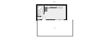 A floor plan of a studio with a bathroom and patio.
